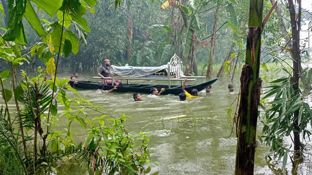 কেশবপুরে চারদিকে পানি, নৌকায় করে লাশ নেওয়া হলো কবরস্থানে