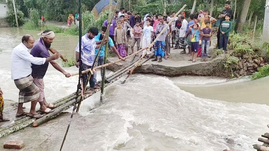 বাসাইলে সড়ক ভেঙে ৮ গ্রামের নিম্নাঞ্চল প্লাবিত